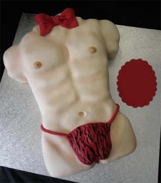 Cake shaped like a male torso with defined abs, wearing a red bow tie and a red and black animal print design that resembles underwear.