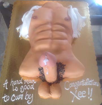 A cake shaped like a muscular male torso, with white frosting resembling a cowboy hat on top. It has detailed abs and humorous decorations. The text reads, A hard man is good to cum by. Congratulations Xee!!.