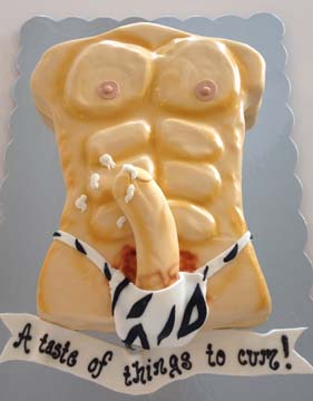 A humorous cake shaped like a male torso with abs, topped with a suggestive design. The cake includes fondant elements resembling a bikini bottom and has the text A taste of things to cum! displayed at the bottom.